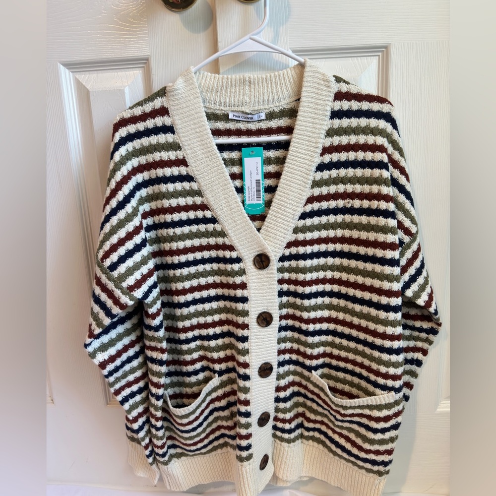 A green, white, blue, and Orange stripped sweat. Perfect for the fall and winter